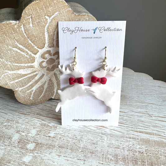 White Reindeer Red Bow Clay Earring